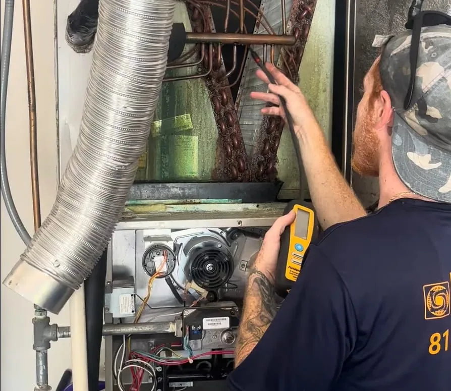 Refrigerant leak detection equipment in use on a residential system