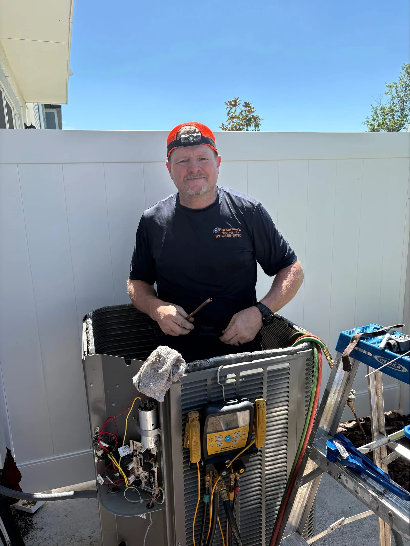 Parkersons HVAC technician performing seasonal system maintenance